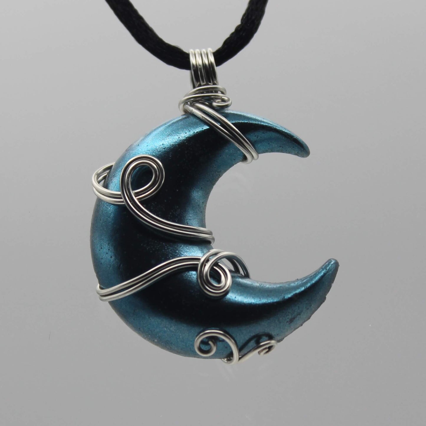 Light Blue and Silver Resin Moon Wire Wrapped Pendant